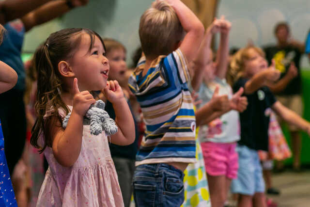 Preschoolers singing and dancing at the Waumba Land Playhouse.