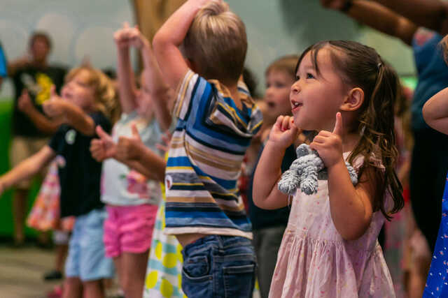 Preschoolers singing and dancing at the Waumba Land Playhouse.