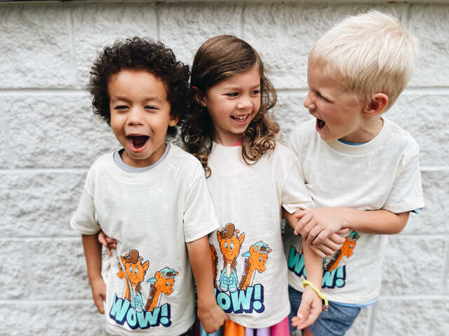 Preschool children wearing Waumba Land's WOW summer shirt