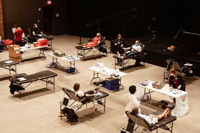 people giving blood at a blood drive